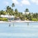 People paddleboarding in the water of Rum Point Beach, Cayman Islands